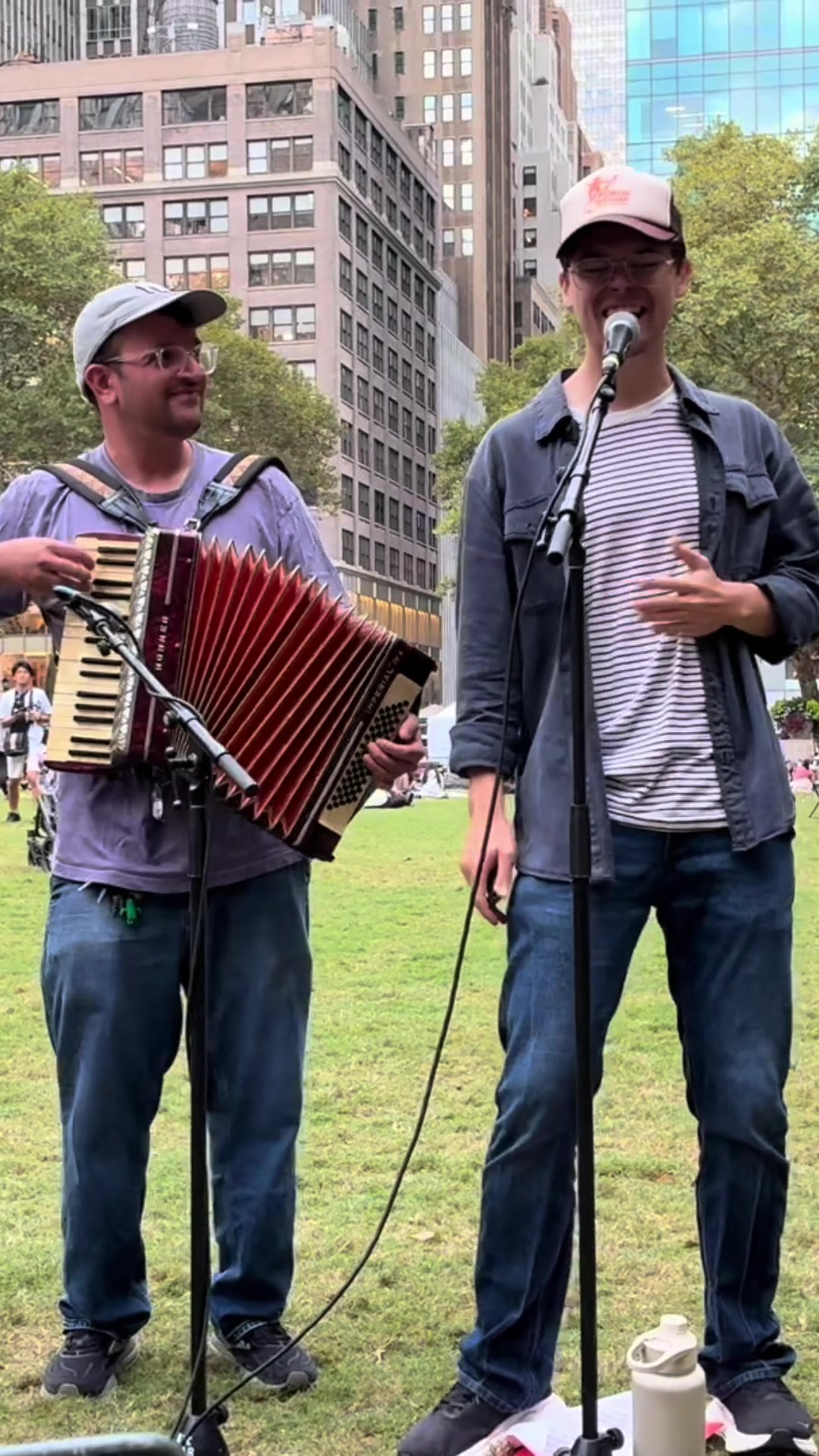 Andrew singing beside Sweetgum’s accordionist at Bryant Park